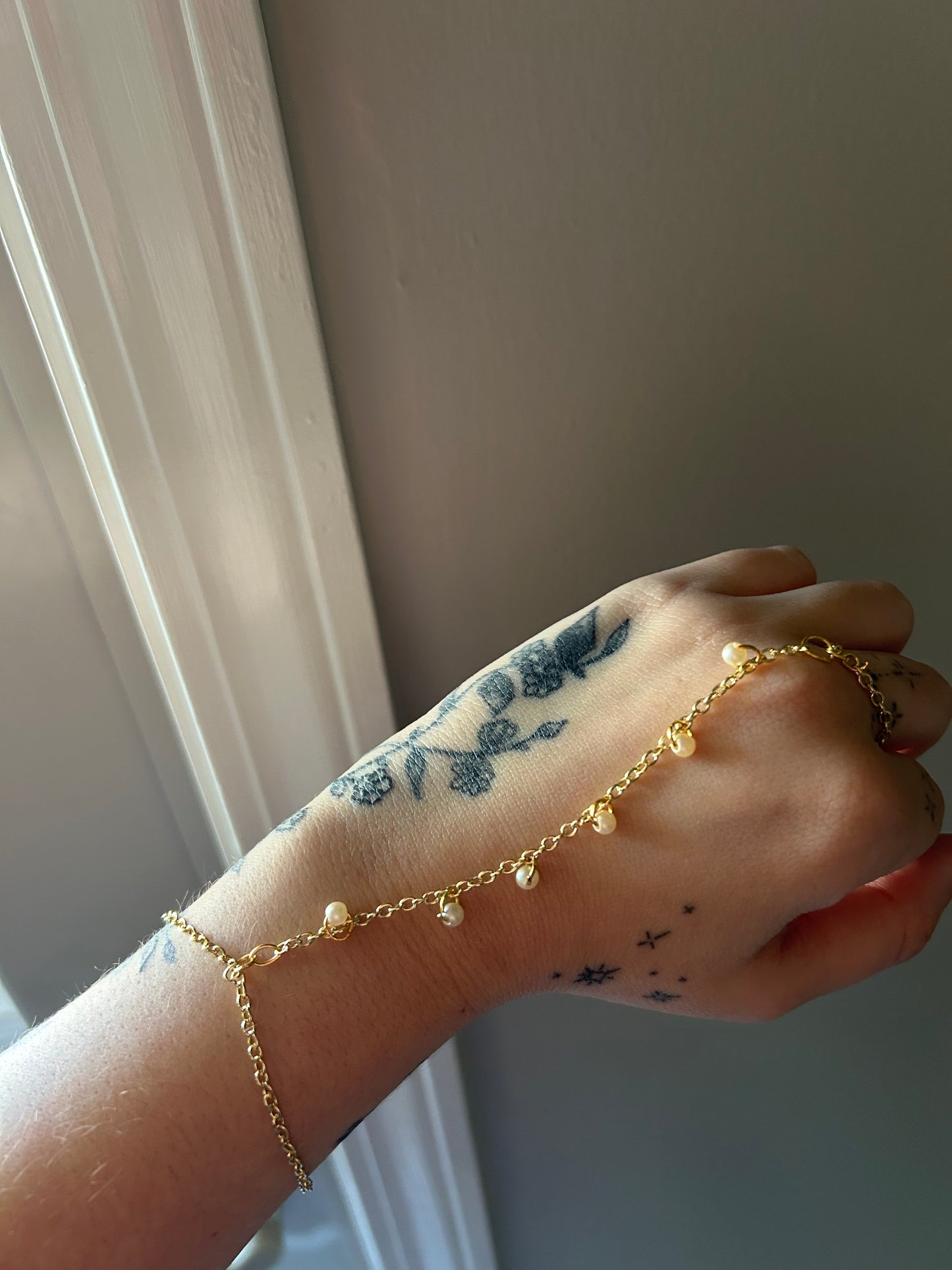 Gold Pearls Hand Chain